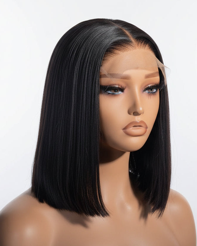 Mannequin head with a black bob wig on a white background