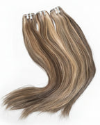 Set of hair extensions on a white surface