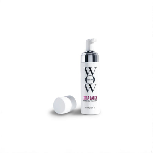 A White Color Wow Xtra Large Bombshell Volumizer bottle with 'WOW' branding on a white background