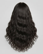 Black wavy Indian raw hair extension on a gray background