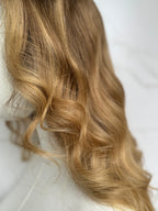 Blonde hair with wavy texture on a white background