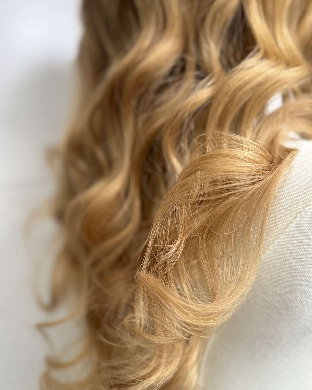 Close-up of blonde hair with a blurred background