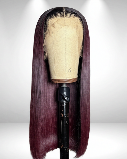 Front view of Noire ombre Cambodian raw hair glueless wig in 1B/99J on a mannequin stand, showing bone-straight hair and elastic band cap construction