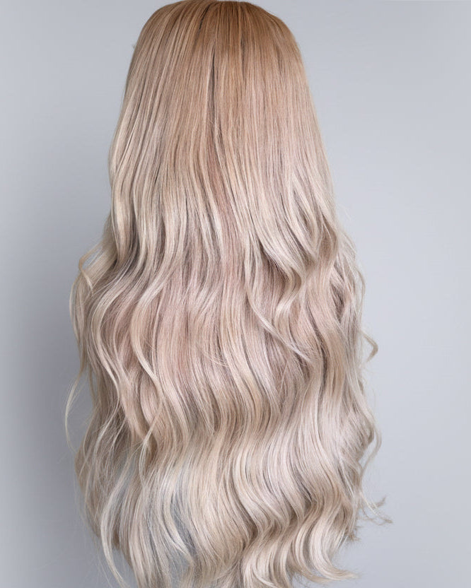 Blonde wig with wavy Vietnamese raw hair on a neutral background
