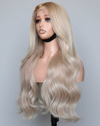 Blonde raw Vietnamese hair wig made from single donor bundles on a mannequin head against a plain background